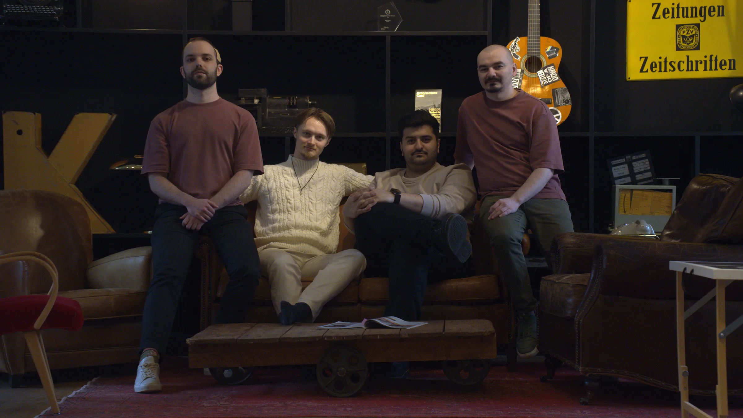 The four founders on a leather sofa in a dim room. From left: Moritz Falk, Sander J. Skjegstad, Wassim Alhajomar and Victor Caraulan.